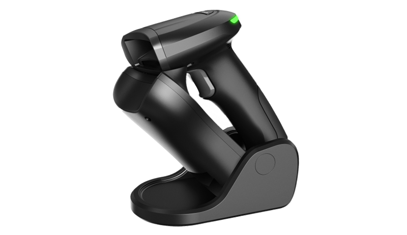 Handheld barcode scanner on a table.
